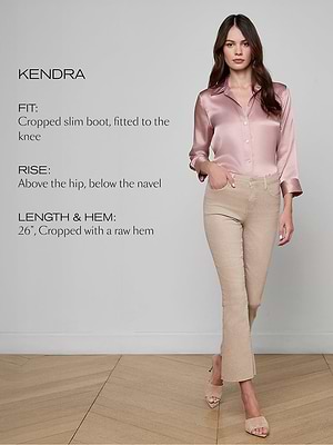 Woman wearing a pink satin shirt and beige pants with text describing the fit, rise, and length of the pants.