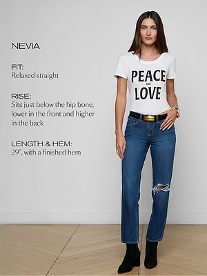 Woman wearing a white t-shirt with 'PEACE AND LOVE' and blue jeans on a plain background.