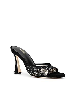 The Avery Lace Open-Toe Mule is a stylish black stiletto featuring a delicate black lace overlay, open-toe design, sleek curved heel, and a black insole with gold branding.