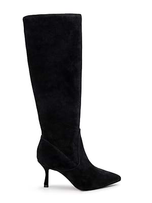 The Marya Knee-High Boot by L'AGENCE features black suede, a pointed toe, and a slim mid-height stiletto heel. It offers extra comfort with a memory foam insole, shown in side profile against a white background.