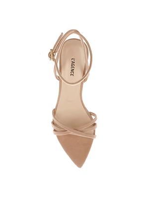 The Dua Suede Sandal is a beige strappy high heel with a pointed toe, stiletto heel, and ankle strap with a gold buckle. The LAGENCE-branded insole is visible in the top-down photo on a white background.
